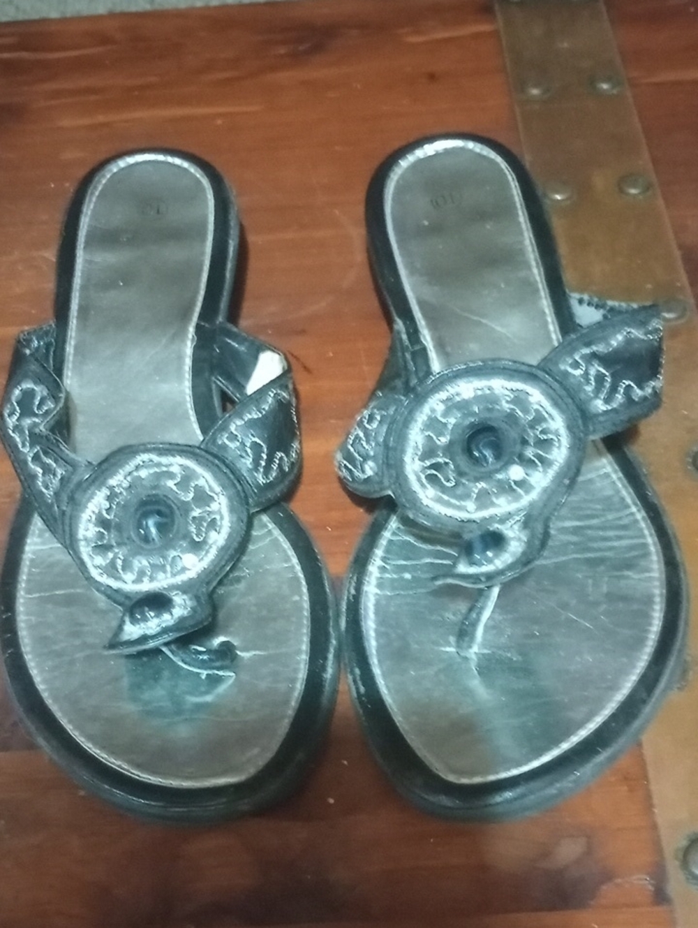 Women’s Black Slip-On Sandals with Decorative Medallion